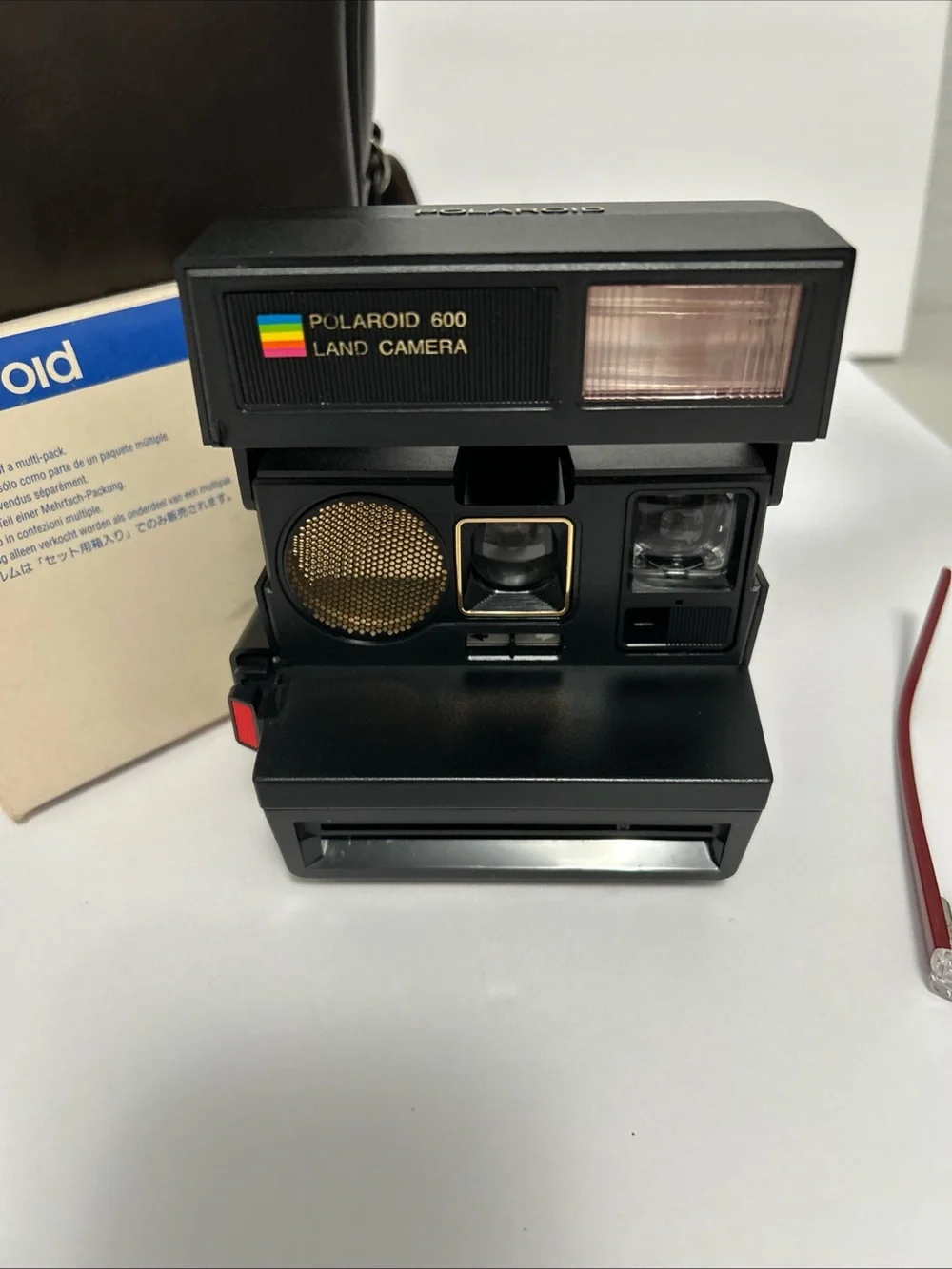 Vintage Polaroid 600 instant camera with case and film
